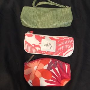 Three small Clinique makeup bags